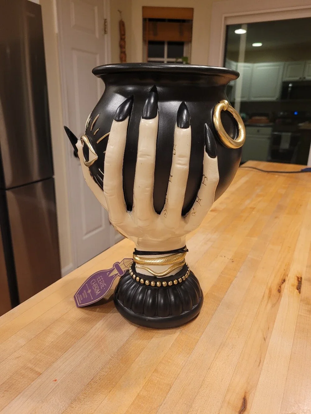 Eerie Charm Evil Eye Cauldron Held By A Witch's Hand - Black and Cream